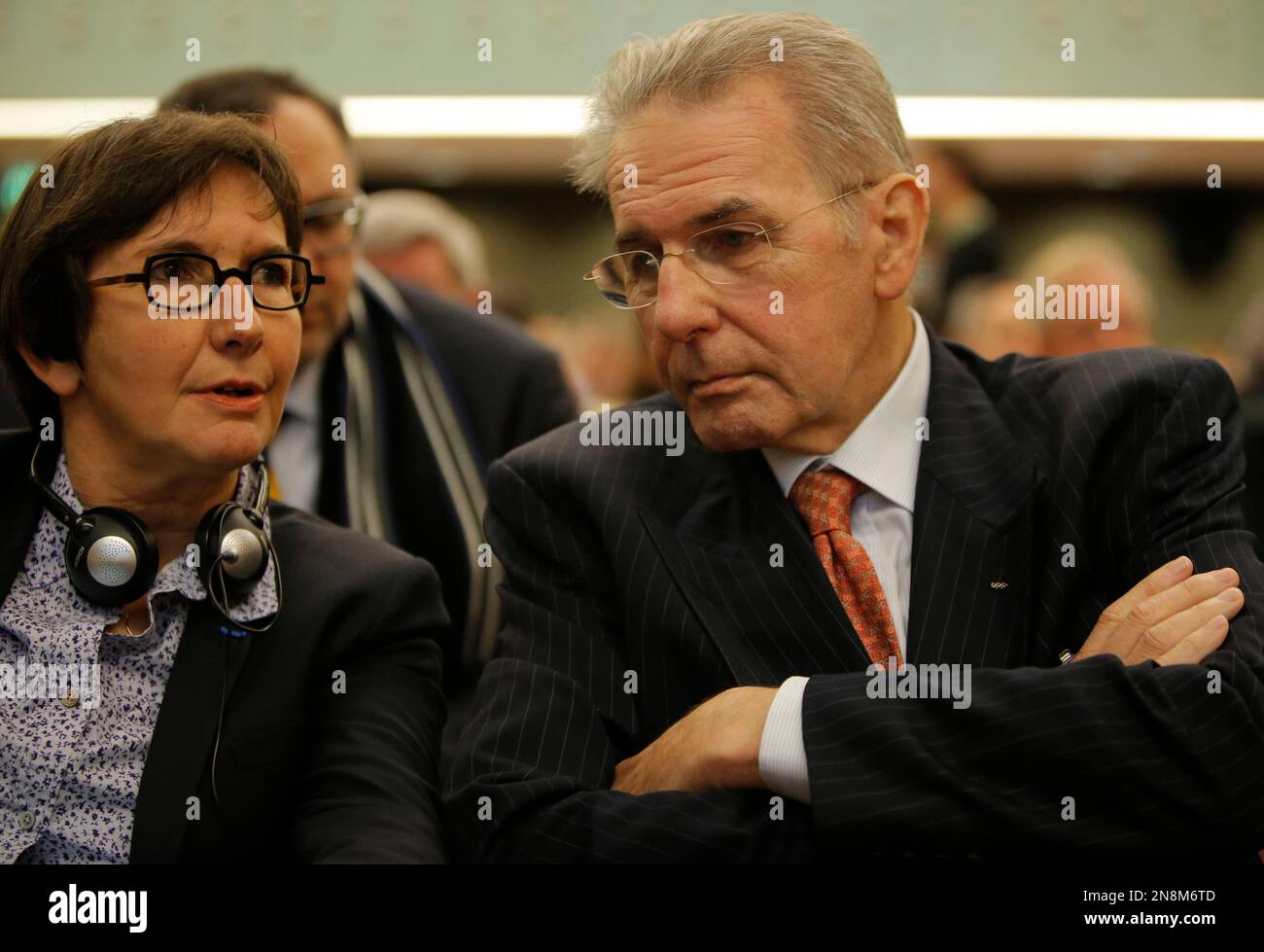 International Olympic Commitee President Jacques Rogge, right, listens to French Sports minister Valerie Fourneyron during a symposium called "The Pharmaceutical Industry and the Fight against Doping : New Partnerships for Clean Sport" in Paris Monday, Nov. 12, 2012. The international conference is looking at ways to unite the pharmaceutical industry and sports authorites in the fight against doping (AP Photo/Francois Mori) Banque D'Images