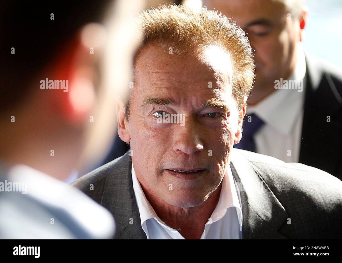 Film star and former Gov. of California Arnold Schwarzenegger leaves after he inaugurates a triathlon competition as a part of the Arnold Classic Europe event in Madrid, Spain, Sunday, Oct. 14, 2012. (AP Photo/Andres Kudacki) Banque D'Images