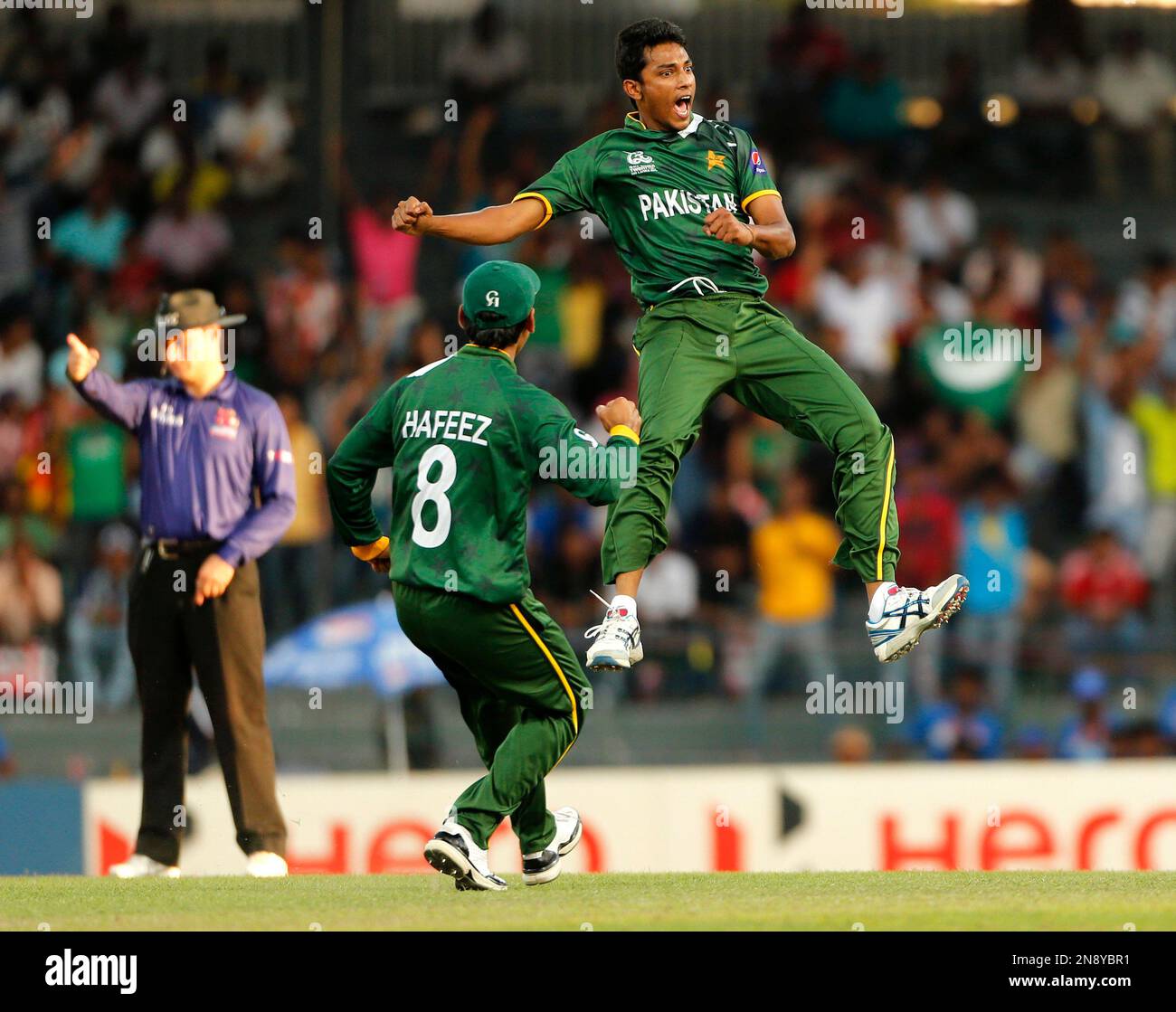 Pakistan Raza Pakistan's bowler Raza Hasan, right, celebrates taking the wicket of ...