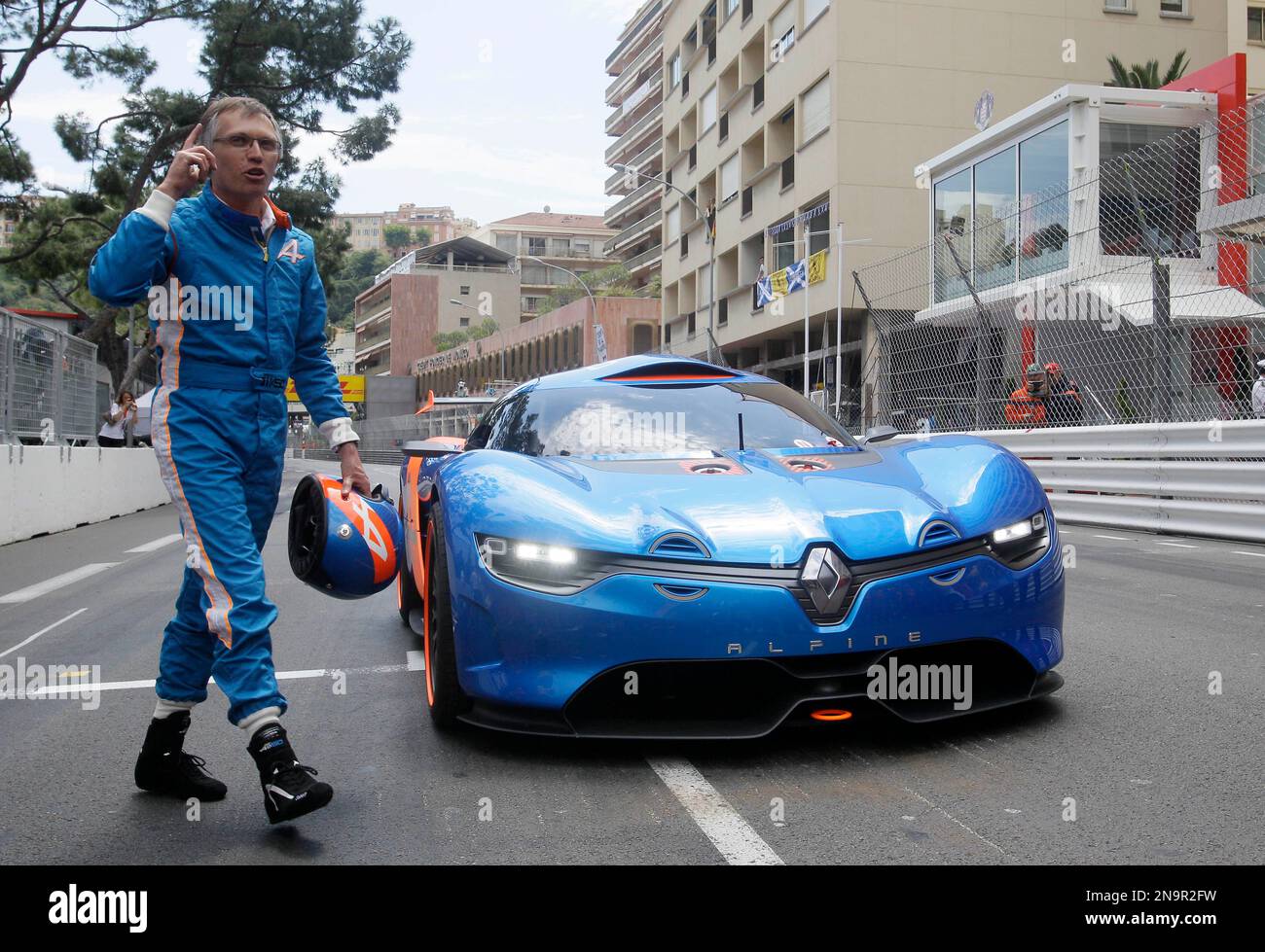 Renault Chief Operating Officer Carlos Tavares walks next a new Renault concept car, at the Monaco racetrack, in Monaco, Friday, May 25, 2012. France automaker Renault unveils a concept car, designed to commemorate 50 years of its brand.(AP Photo/Antonio Calanni) Banque D'Images