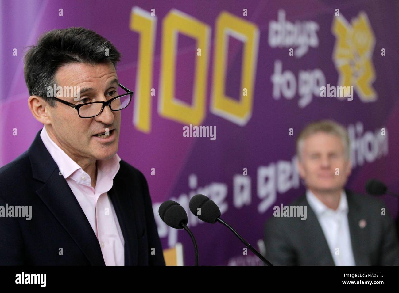 Chairman of London Organising Committee of the Olympic and Parlympic Games (LOCOG), Sebastian Coe, left, speaks to the media as CEO of LOCOG Paul Deighton looks on at Kew Royal Botanic Gardens in London to mark 100 days before the start of the London 2012 Olympic Games, Wednesday, April 18, 2012. The opening ceremony will take place on July 27, 2012. (AP Photo/Sang Tan) Banque D'Images