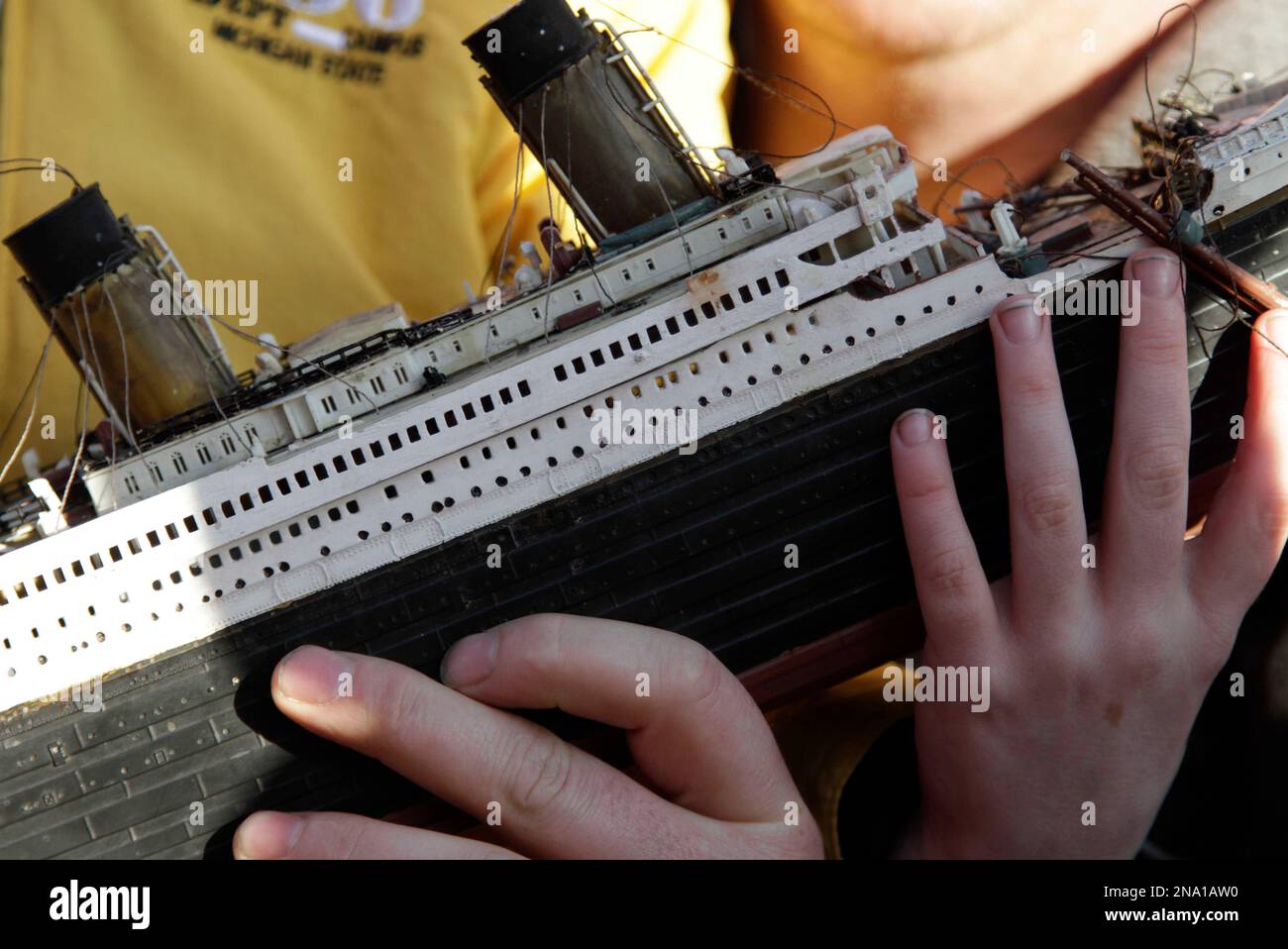 Scully, 6, last name not given, holding a model of the Titanic, poses for pictures with Lload Walsh, as they wait to greet the disembarking passengers of the MS Balmoral Titanic memorial cruise ship at its first stop in Cobh, Ireland, Monday, April 9, 2012. Nearly 100 years after the Titanic went down, the cruise with the same number of passengers aboard is setting sail to retrace the ship's voyage, including a visit to the location where it sank.With 1,309 passengers aboard, the MS Balmoral will follow the same route as the Titanic and organizers are trying to recreate the onboard experience Banque D'Images