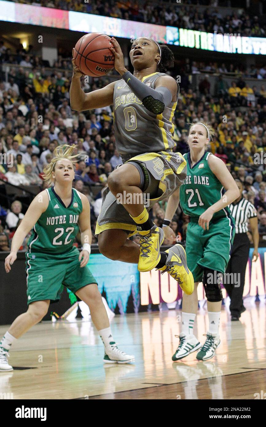 Baylor guard Odyssey Sims (0) heads to the hoop as Notre Dame guard Brittany Mallory (22) and Notre Dame guard Natalie Novosel (21) look on during the first half in the NCAA women's Final Four college basketball championship game, in Denver, Tuesday, April 3, 2012. (AP Photo/Eric Gay) Banque D'Images
