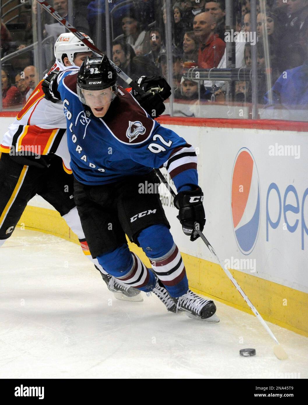 Colorado Avalanche left wing Gabriel Landeskog (92), from Sweden, skates past Calgary Flames left wing Curtis Glencross (20) during the third period of an NHL hockey game Tuesday, March 20, 2012, in Denver. (AP Photo/Jack Dempsey) Banque D'Images