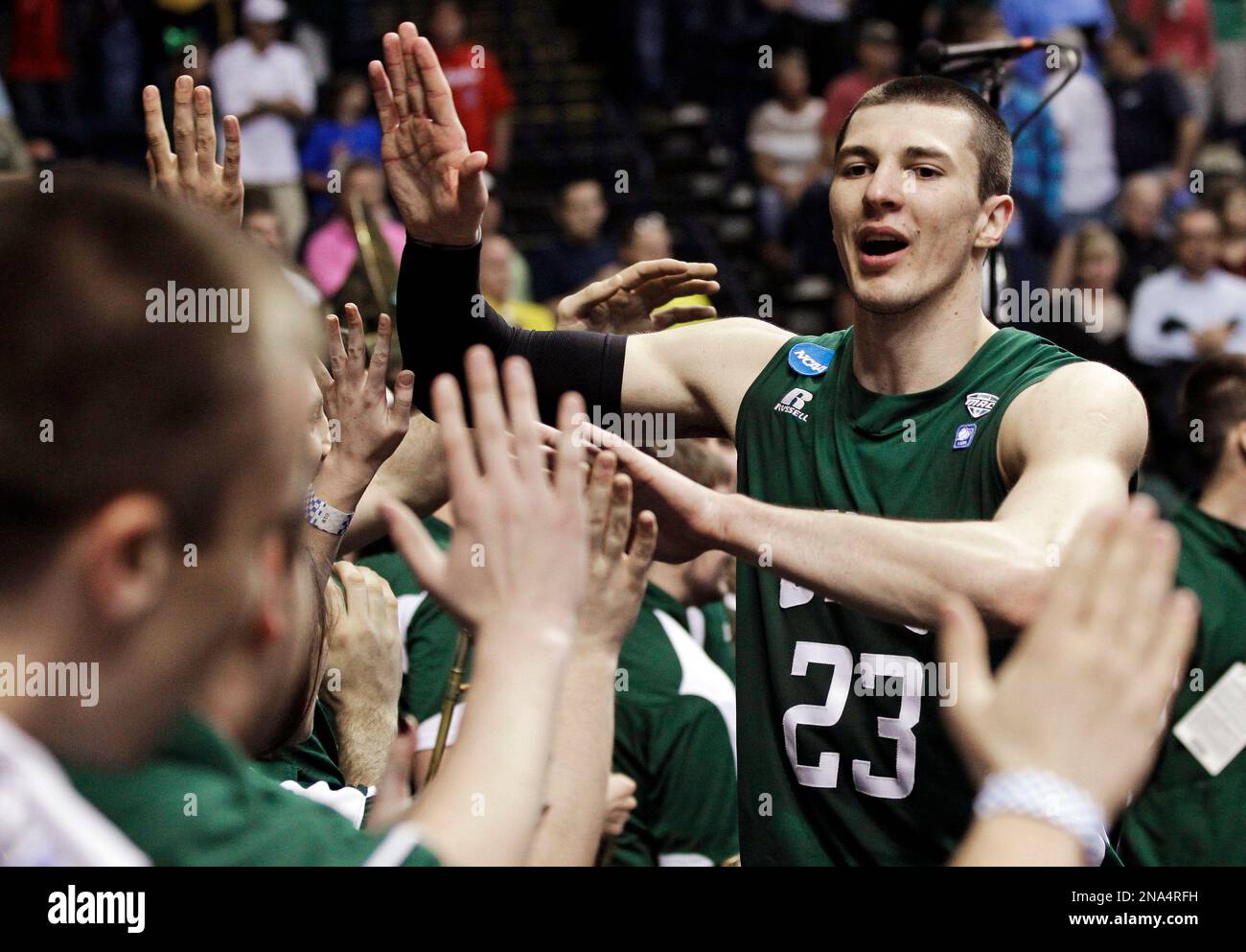 Ohio forward Ivo Baltic (23) celebrates with the pep band after Ohio defeated Michigan 65-60 in a second-round NCAA college basketball tournament game on Friday, March 16, 2012, in Nashville, Tenn. (AP Photo/Mark Humphrey) Banque D'Images