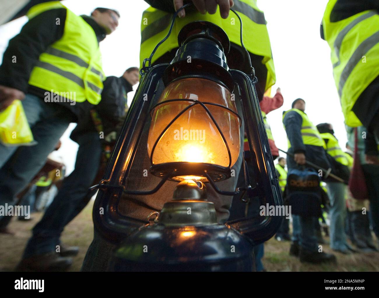 A child holds a lantern during a demonstration to commemorate the