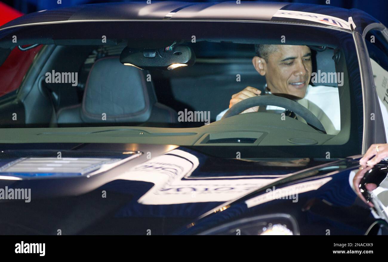 President Barack Obama sits inside a Chevrolet Corvette ZR1 during his visit to the Washington Auto Show at the Washington Convention Center in Washington, Tuesday, Jan., 31, 2012. (AP Photo/Pablo Martinez Monsivais) Banque D'Images