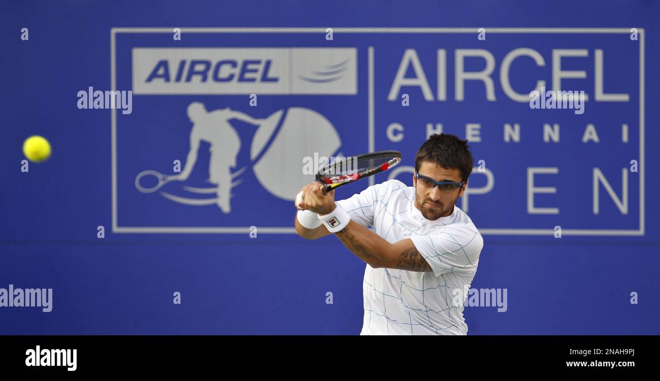 Serbia's Janko Tipsarevic plays a backhand during the final match against Canada's Milos Raonic at the ATP Chennai Open 2012 tennis tournament in Chennai, India, Sunday, Jan. 8, 2012. (AP Photo/Aijaz Rahi) Banque D'Images