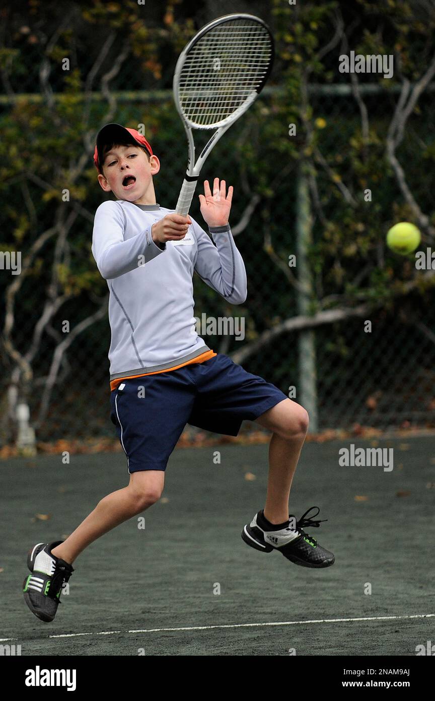 In this Dec. 10, 2011, photo, tennis student Matthew Oliver practices