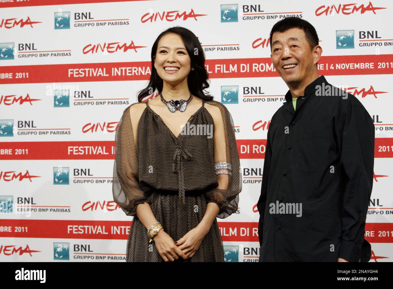 Chinese director Gu Changwei and actress Zhang Ziyi pose during a photocall to present their movie "Love for Life" at the 6th edition of the Rome International Film Festival in Rome, Wednesday, Nov. 2, 2011. (AP Photo/Domenico Stinellis) Banque D'Images