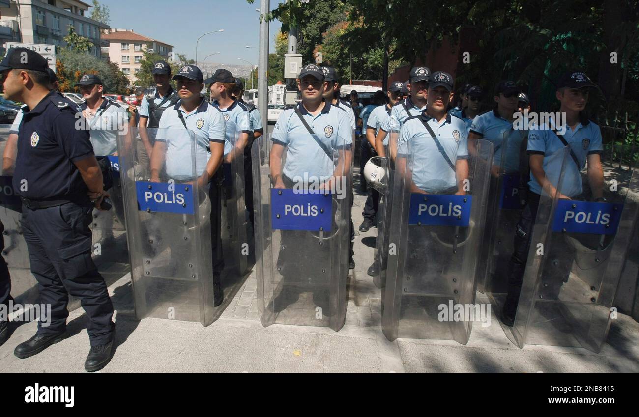 Riot police stand guard as a group of pro-Palestinian Turks stage a ...