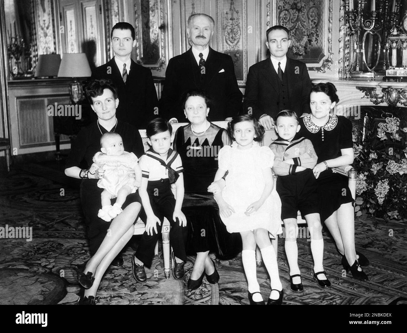 President of France Albert Lebrun and his family pose for photographers in the Elysee Palace, Paris, on March 17, 1939. Left to right back row, Jean Lebrun, son, President Albert Lebrun and Jean Freysselinard, son-in-law. Madame Jean Lebrun, wife of the President sits in the centre of the front row. (AP Photo) Banque D'Images