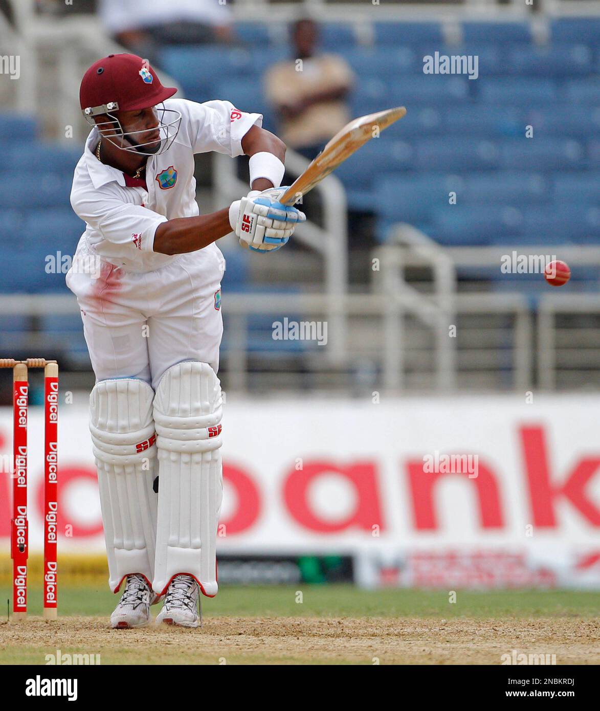 West Indies' opener Lendl Simmons drives the ball to short leg off India's Ishant Sharma, that was caught by Murali Vijay for three runs, on the opening day of their first cricket Test match in Kingston, Jamaica, Monday June 20, 2011. (AP Photo/Andres Leighton) Banque D'Images