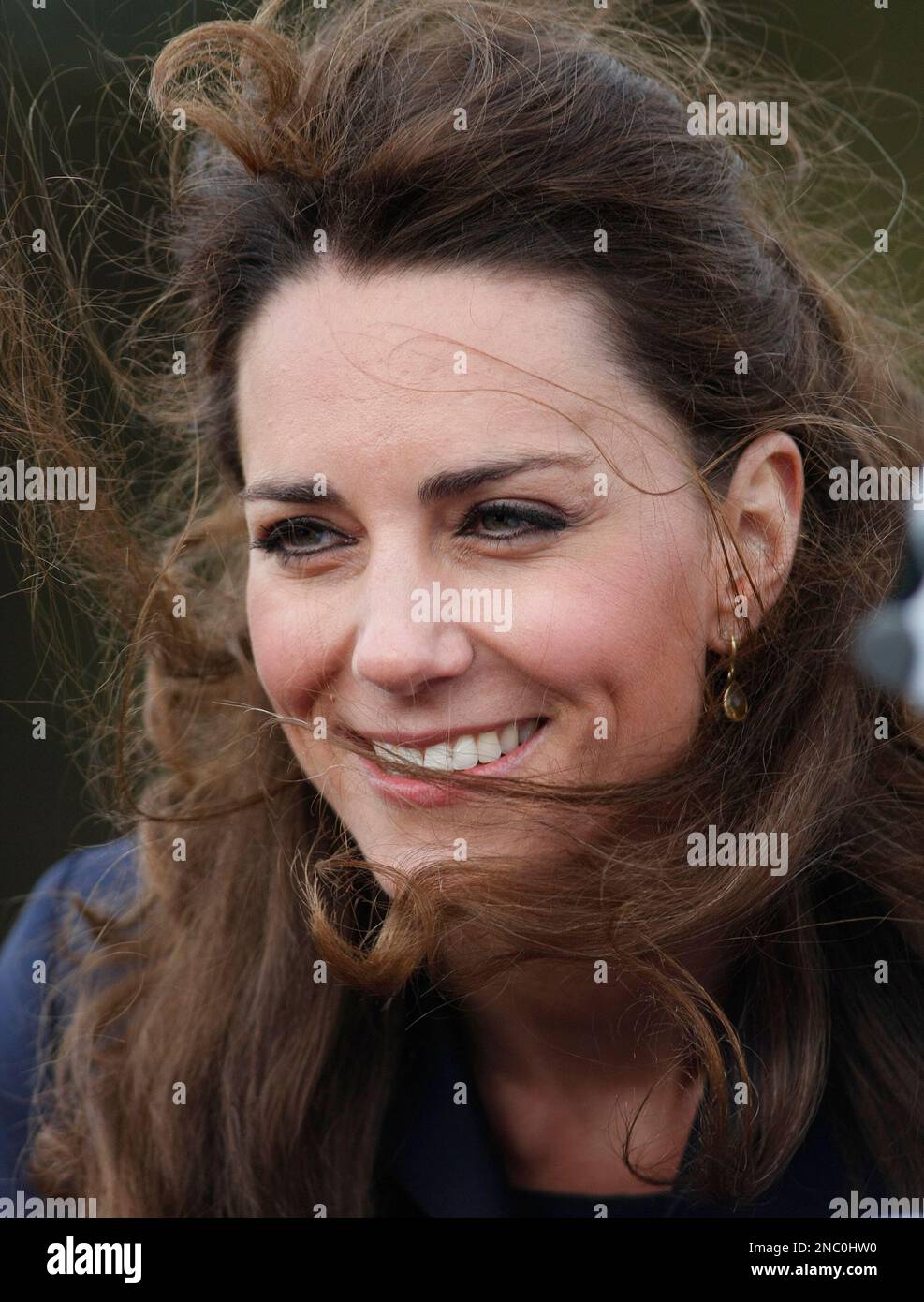Kate Middleton reacts to the crowd, during a visit to Witton County ...