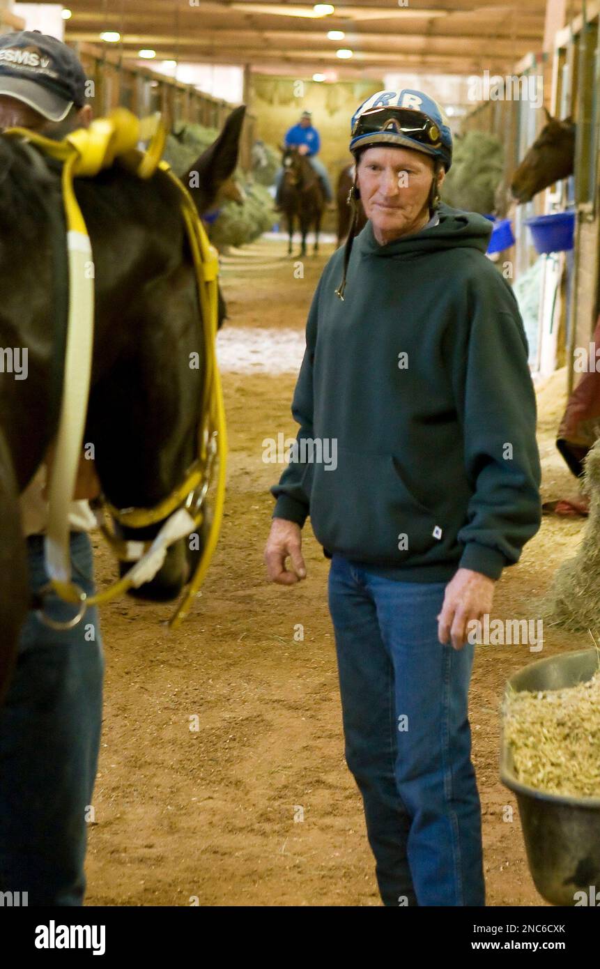 Jockey Roy Brooks checks on one of the quarter horses at Remington Park