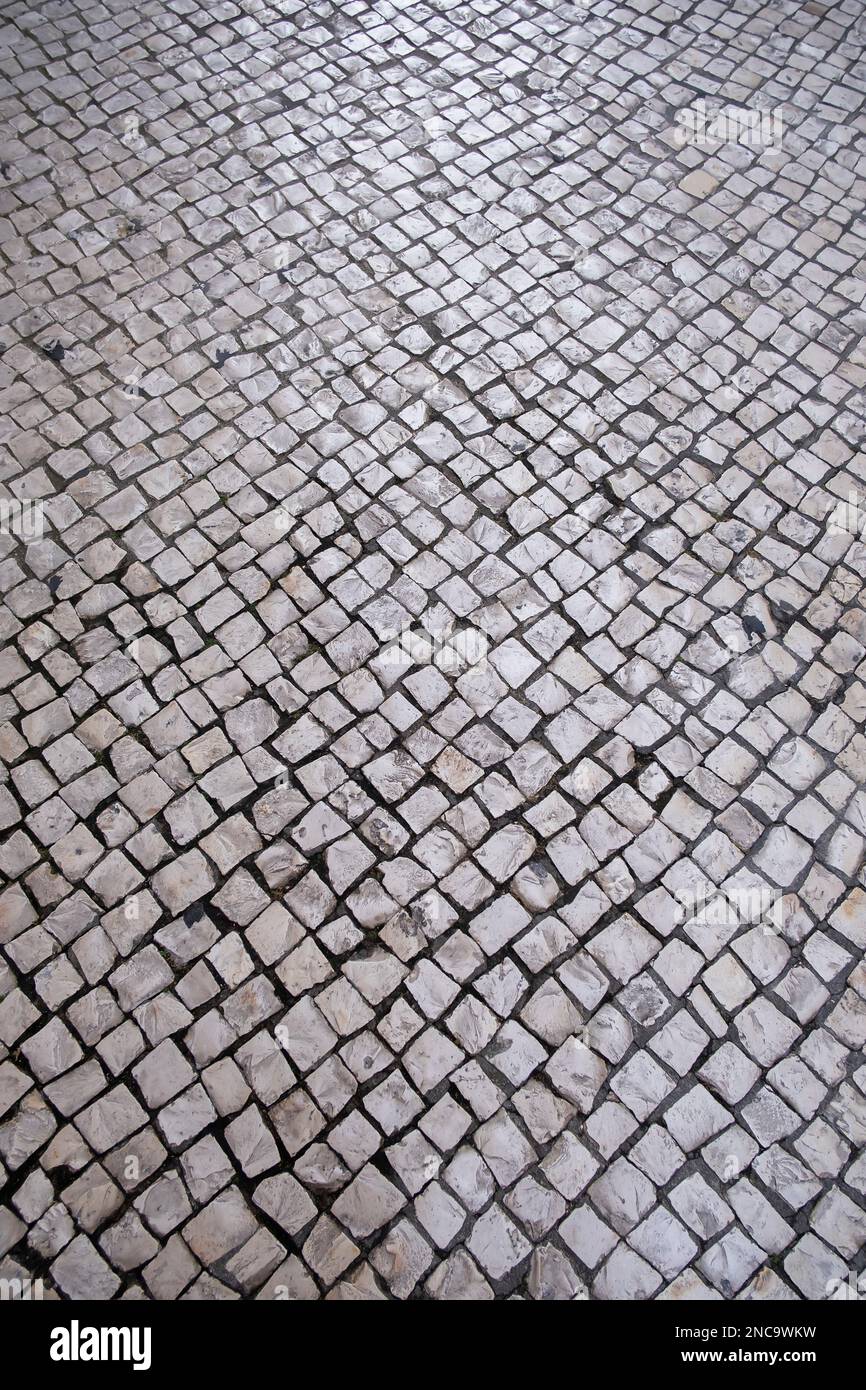 Chaussée portugaise ou pavé portugais, texture pierre pavée, pavé en mosaïque, plancher de rue de lisbonne, vertical Banque D'Images