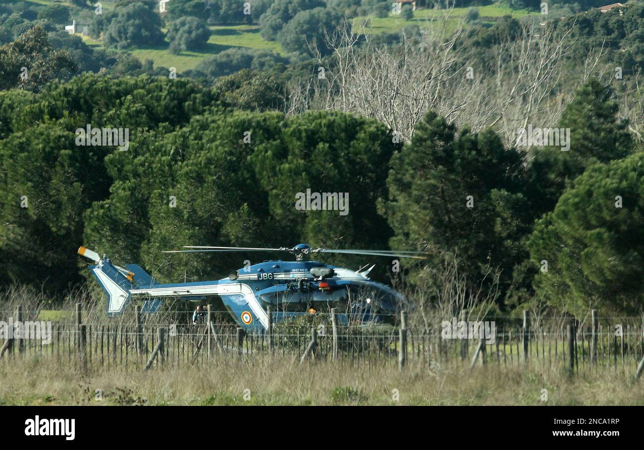 This picture taken Wednesday, Feb. 9, 2011, shows a helicopter of the French Gendarmerie sitting on the ground during a search for missing Swiss twins near Propriano, southern Corsica, France. The search for missing twins spread to Corsica and southern Italy on Wednesday, after authorities confirmed the 6-year-old girls were on a ferry to the French island four days before their father apparently killed himself in Italy. (AP Photo) Banque D'Images