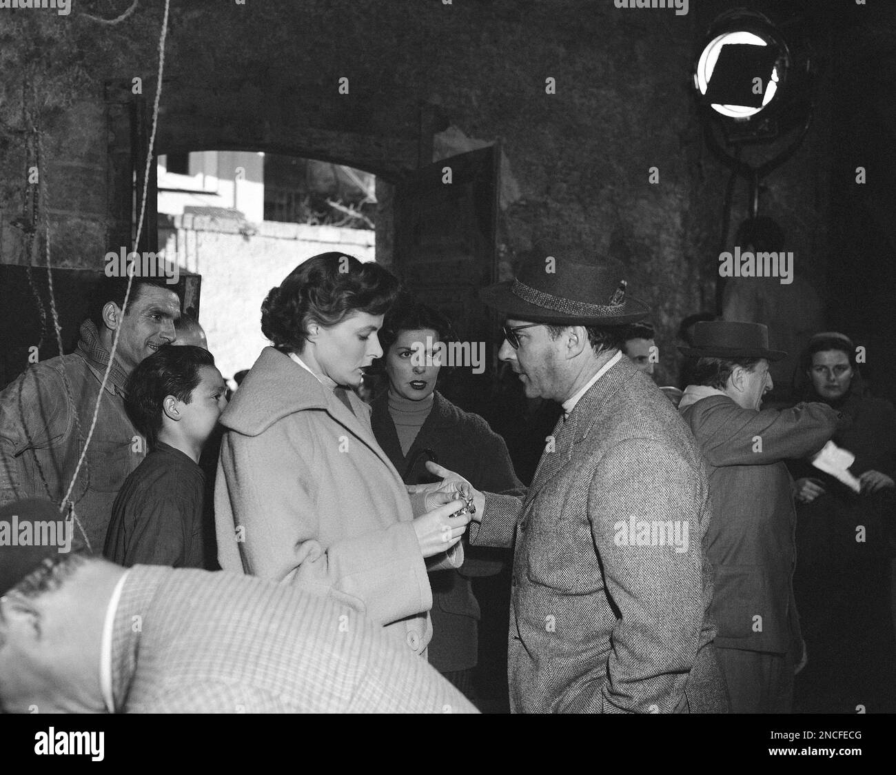 Italian film director Roberto Rossellini explains to his wife, Ingrid ...