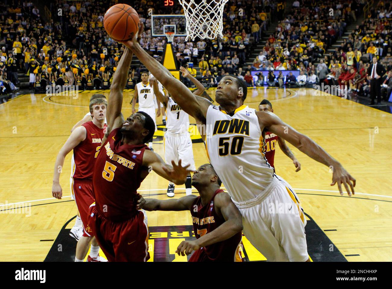 Iowa forward Jarryd Cole (50) fights for a rebound with Iowa State