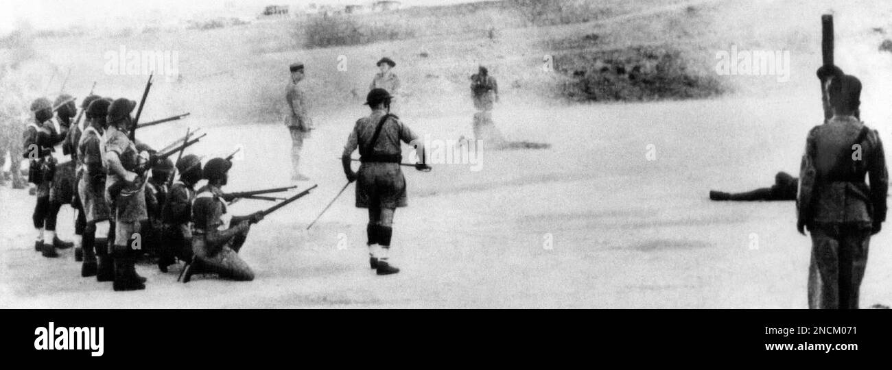 The execution by a French firing squad of two Nazi spies at Aleppo in Syria, Nov. 4, 1943. Both men had been trained in German espionage and sabotage schools before being assigned to the Levant States to spread destruction by blowing up power plants and reservoirs. They also carried poison to put into the food and drink of allied soldiers. Arrested as they stepped off a train at Aleppo, they made full confessions at their trial. (AP Photo/George Aarons) Banque D'Images