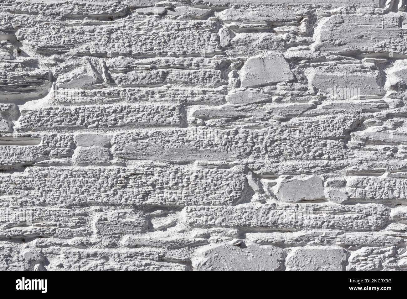 Vieux Mur de pierre peint en blanc Banque D'Images