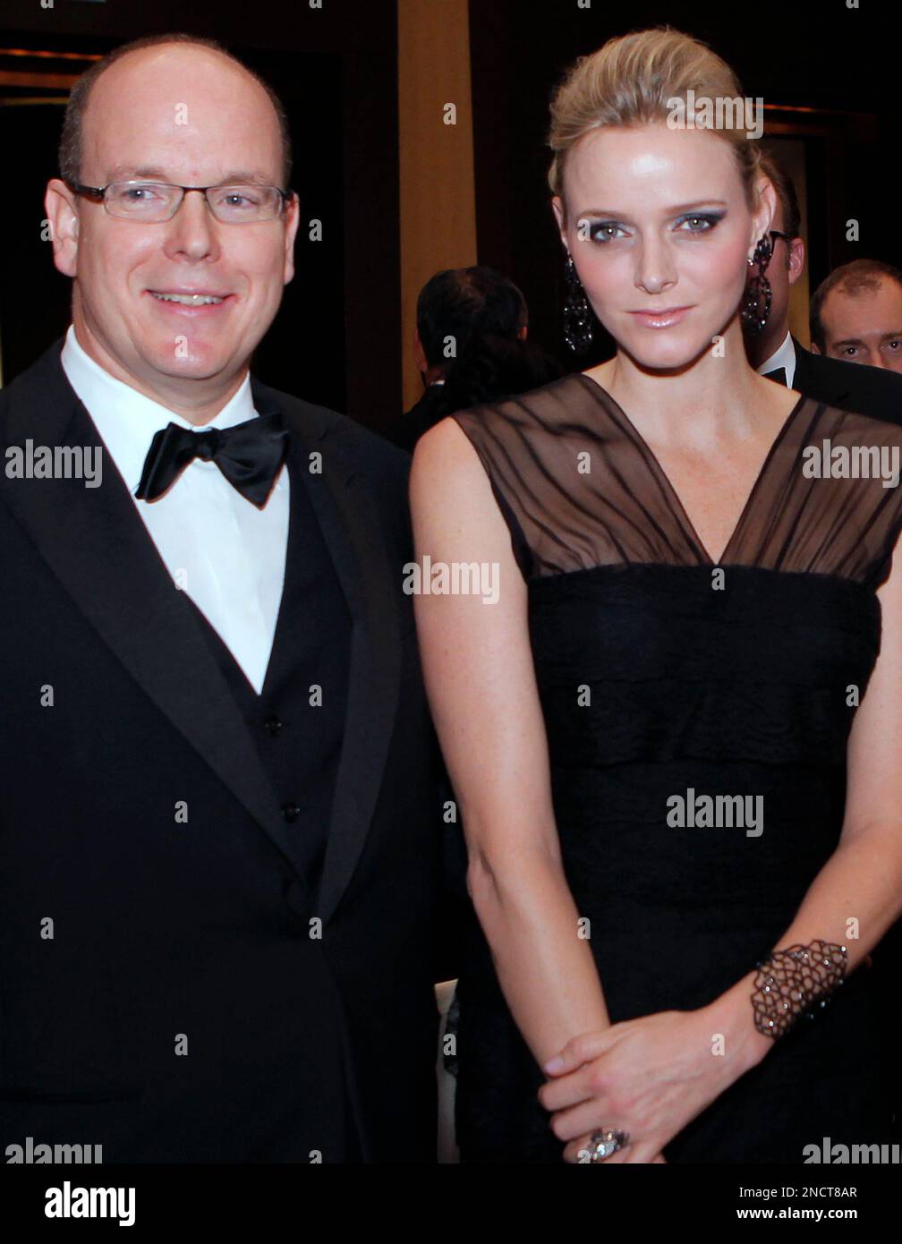 Prince Albert of Monaco, left, and his fiancee Charlene Wittstock attend the BirdLife International gala dinner in Tokyo, Japan, Friday, Oct. 29, 2010. The prince attended the U.N. Convention on Biodiversity meeting in Nagoya, central Japan, earlier in the week. (AP Photo/Itsuo Inouye) Banque D'Images