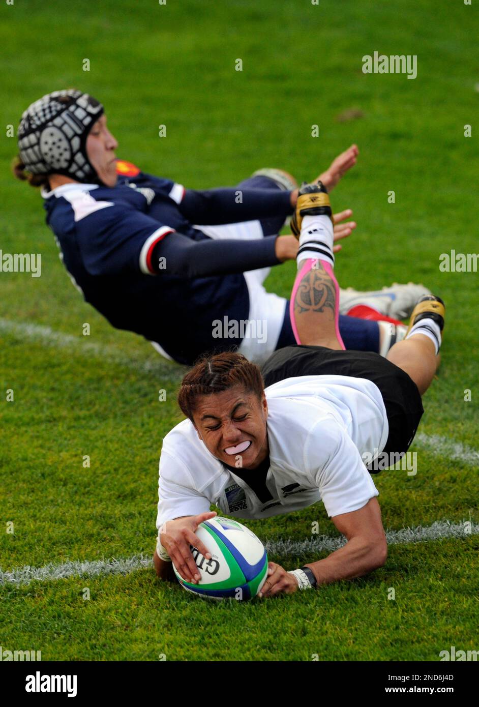 New Zealand's Renee Wickliffe, right, dives for the line to score past ...