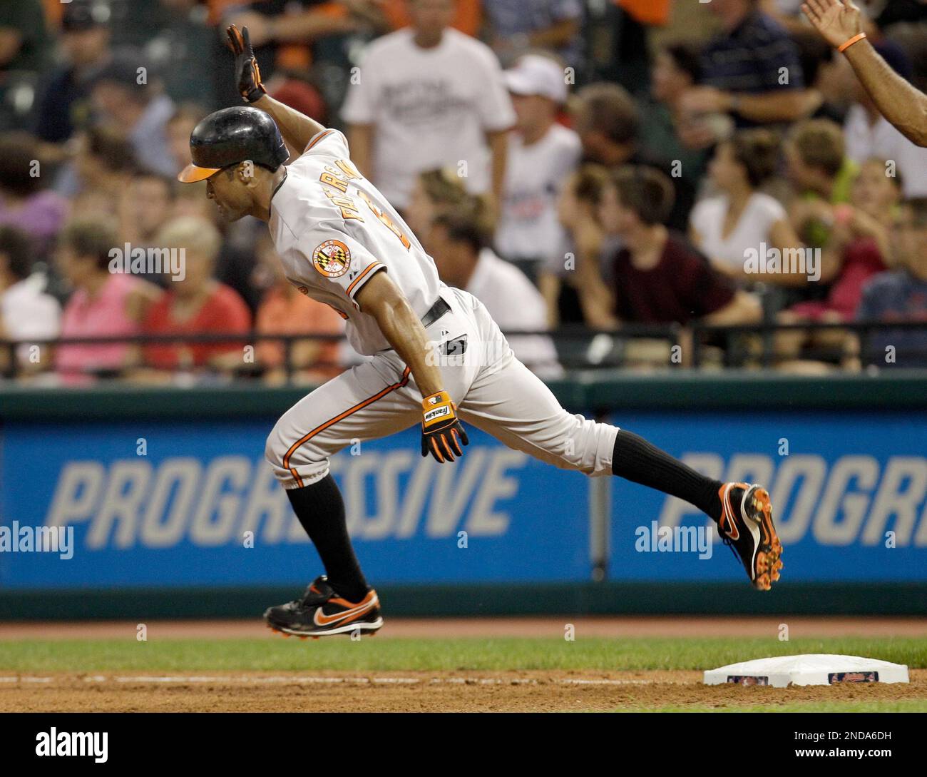 Baltimore Orioles' Corey Patterson celebrates as he rounds first after hitting a solo home run off Cleveland Indians pitcher Tony Sipp in the sixth inning of a baseball game in Cleveland on Tuesday, Aug. 10, 2010. (AP Photo/Amy Sancetta) Banque D'Images