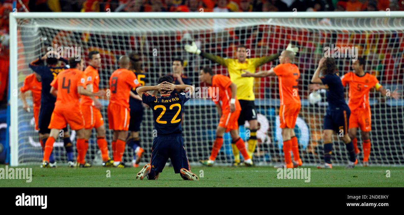 Spain's Jesus Navas, foreground, reacts as Dutch and Spanish players are seen in the background, during the World Cup final soccer match between the Netherlands and Spain at Soccer City in Johannesburg, South Africa, Sunday, July 11, 2010. (AP Photo/Bernat Armangue) Banque D'Images