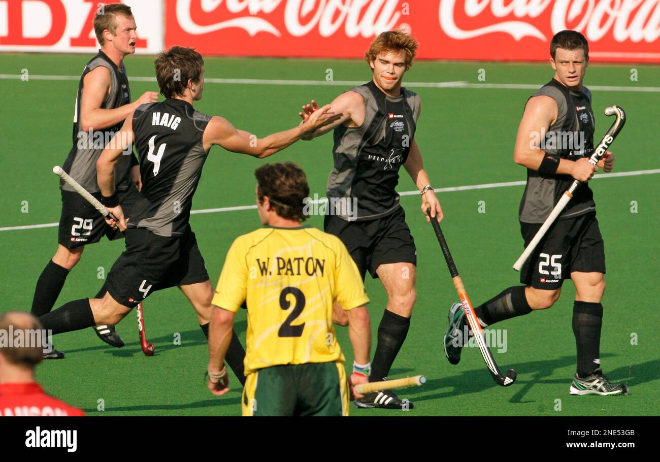 New Zealand's Andy Hayward, third left, celebrates after scoring a goal against South Africa with Nick Haig, second left, as Shea McAleese, right, and Hugo Inglis look on during the International Hockey Federation (FIH) World Cup 2010 field hockey match in New Delhi, India, Friday, March 12, 2010. (AP Photo/Gurinder Osan) Banque D'Images