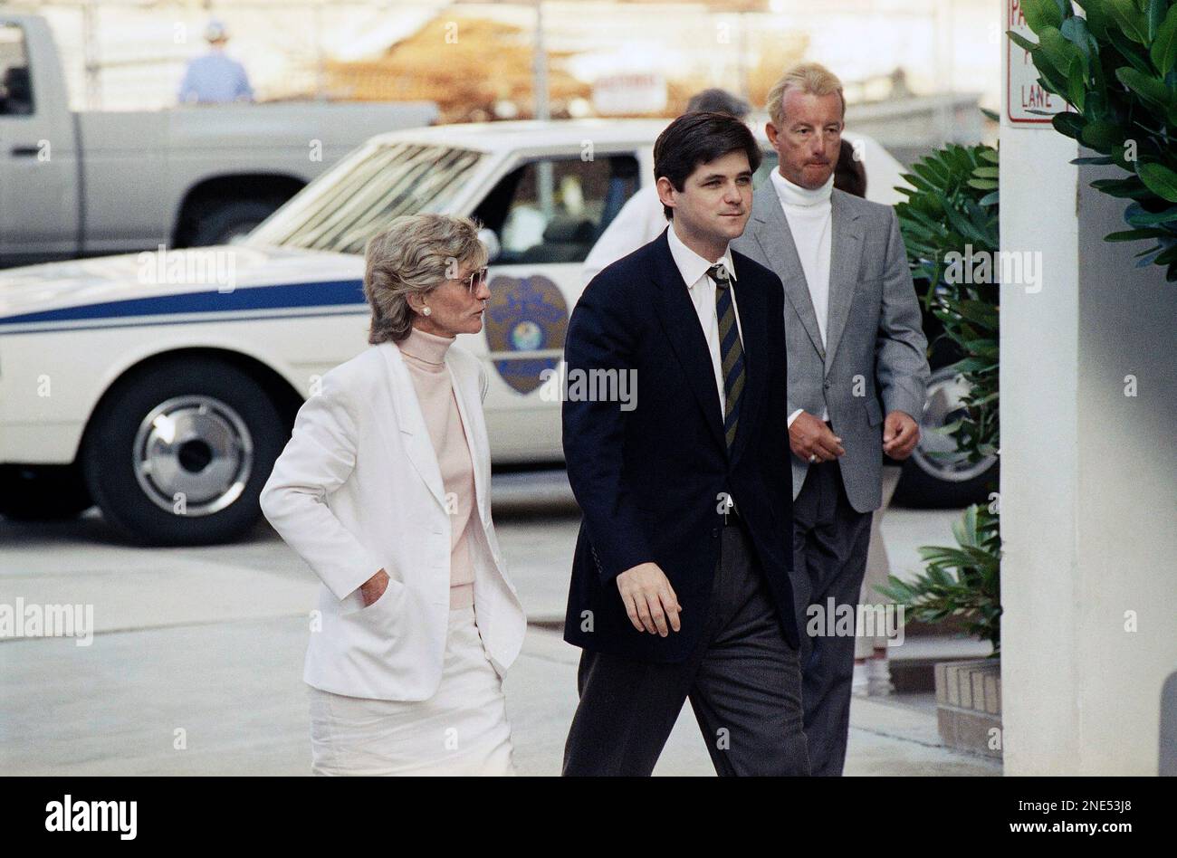 William Kennedy Smith, center, walks with his mother Jean to the Palm