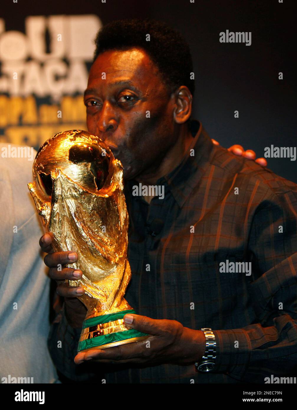 Former star soccer player Pele kisses the FIFA World Cup trophy in Rio de  Janeiro, Saturday, Feb. 6, 2010. The trophy is in Rio de Janeiro as part of  its nine-month world