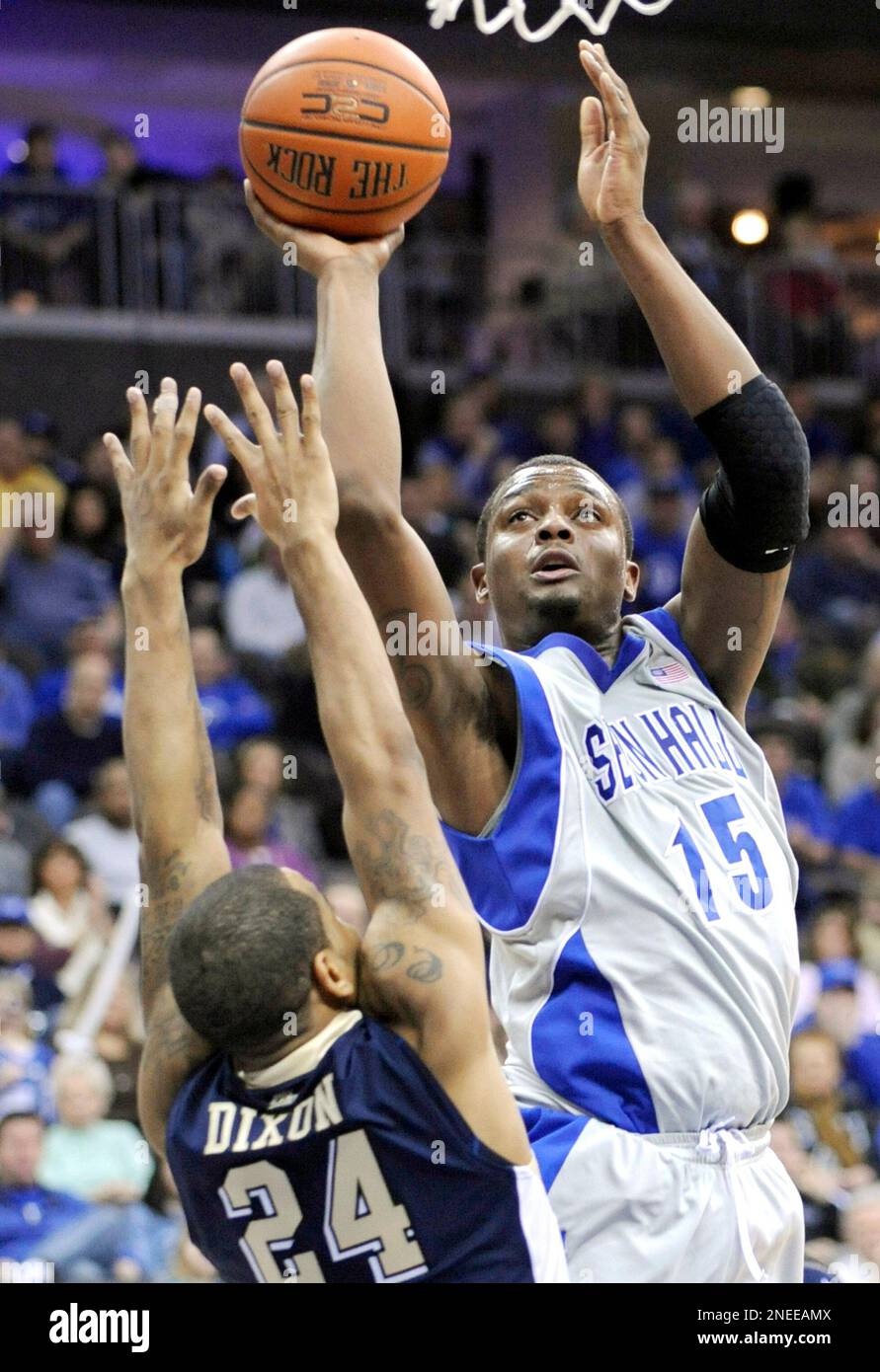 Seton Hall's Herb Pope, right, puts up a shot over Pittsburgh's
