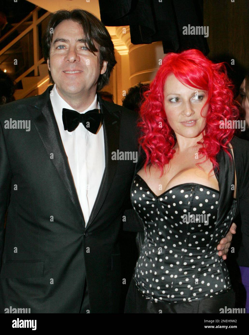 FILE - In this Feb. 8, 2009 photo British television presenter Jonathan  Ross arrives with his wife Jane Goldman at the British Academy Film Awards  2009 after party at The Grosvenor Hotel
