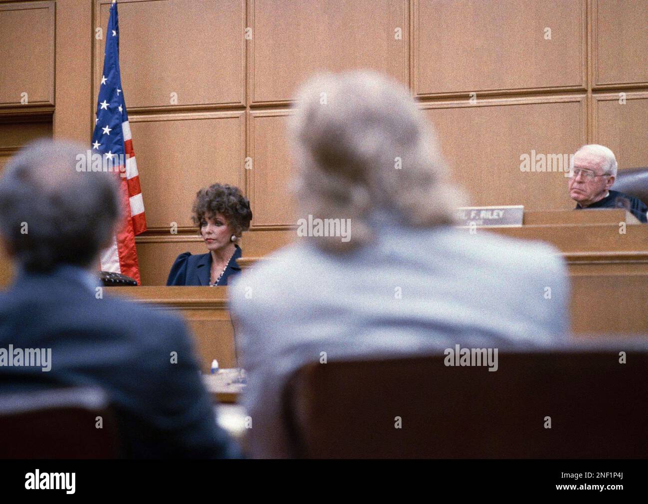 Joan Collins testifying on court while her former husband Peter Holm ...