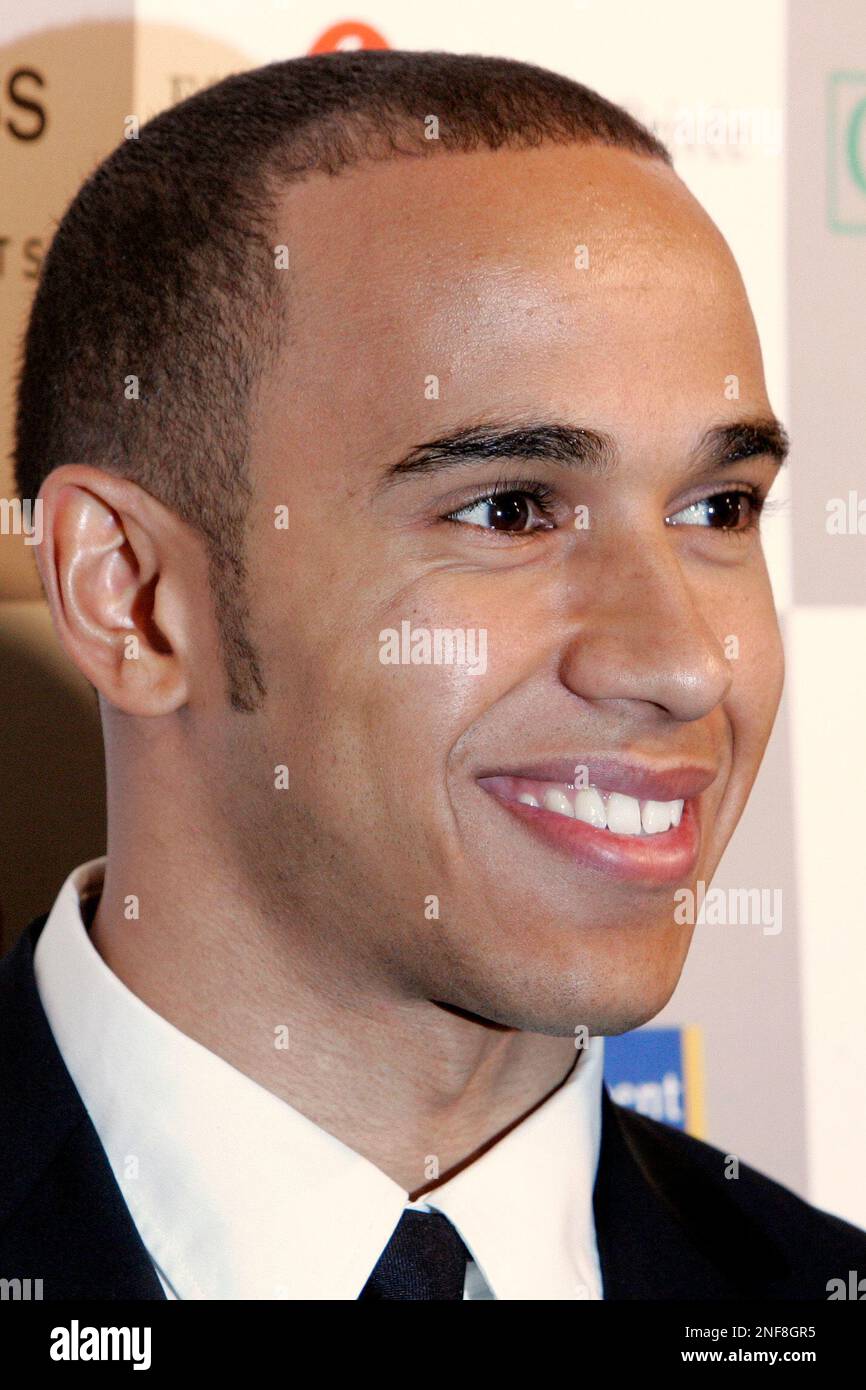 F1 champion Lewis Hamilton of McLaren arrives for the concept cars exhibition within the 24th International Automobile Festival, Paris, Tuesday, Feb. 10, 2009. (AP Photo/Jacques Brinon) Banque D'Images