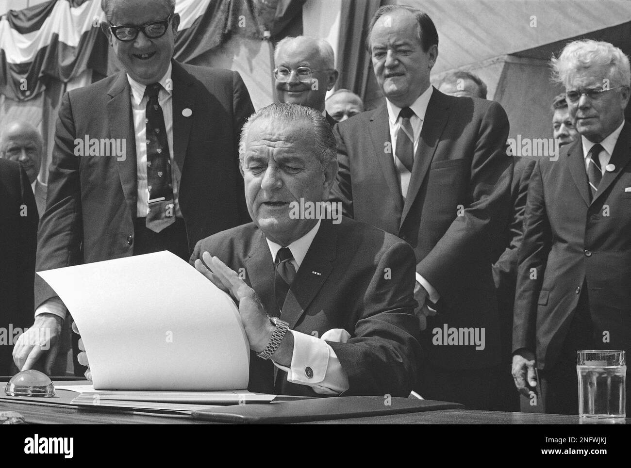 President Lyndon Johnson speaking in front of the Department of Housing