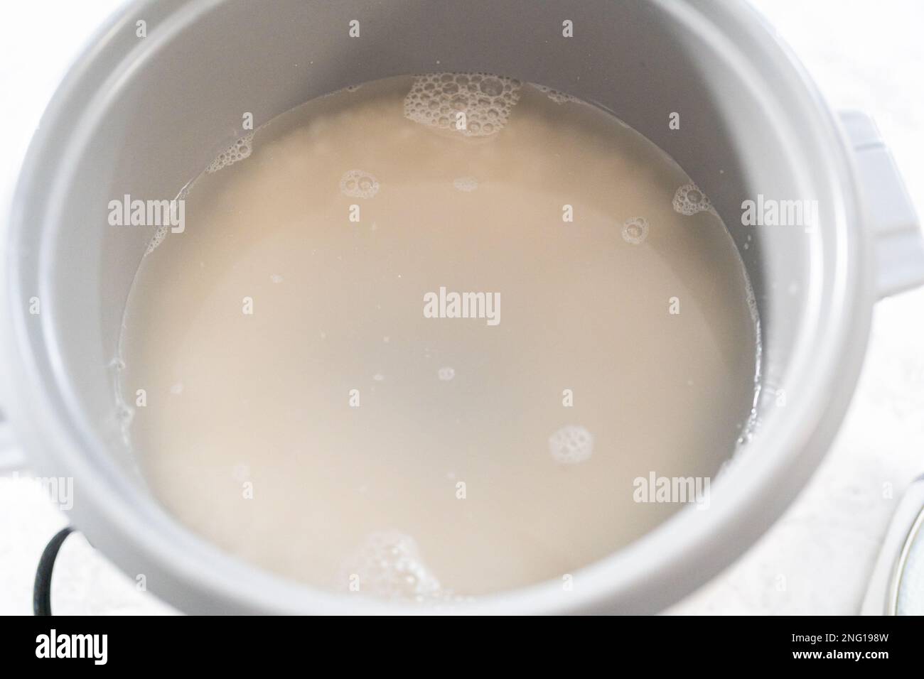Cuisson du riz Banque D'Images Cuisson du riz Banque D'Images