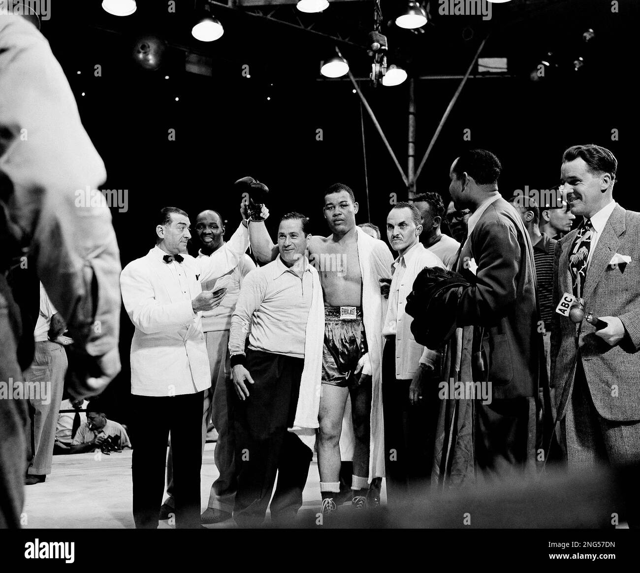 Announcer Harry Balogh raises the hand of Heavyweight Boxing Champion