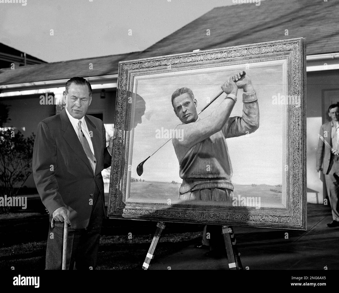 Bobby Jones poses with a portrait of himself that President Dwight
