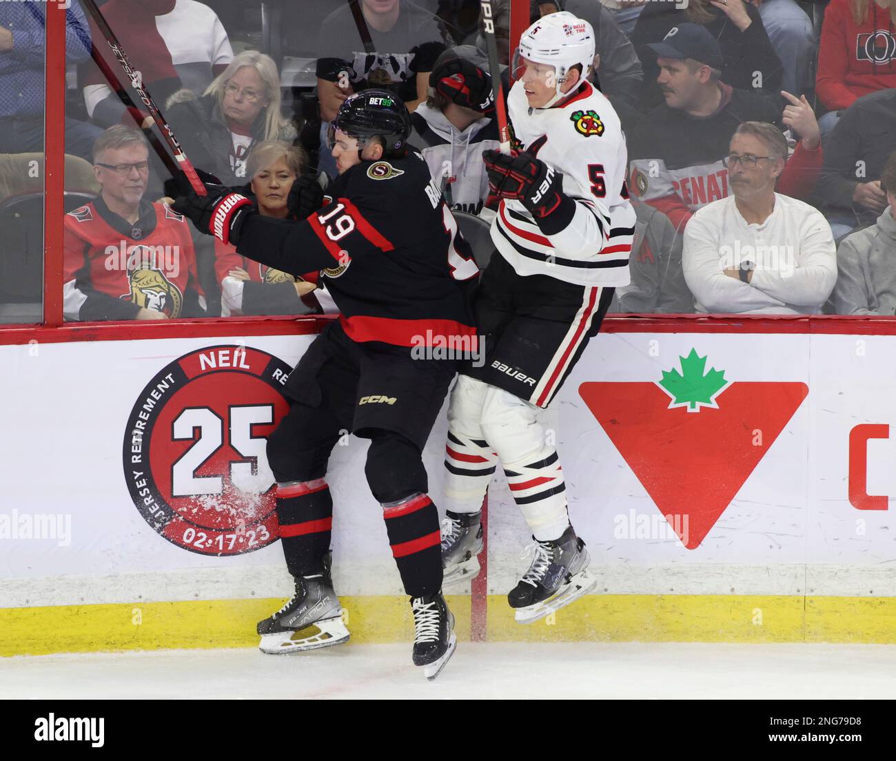 Batherson Ottawa Senators' Drake Batherson (19) checks Chicago Blackhawks' Connor ...