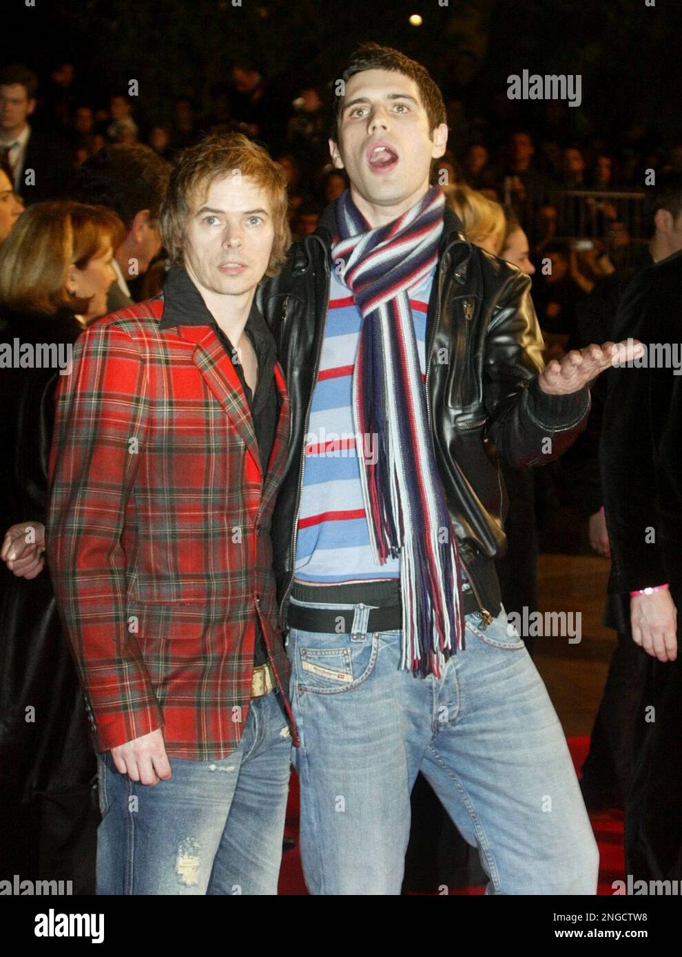 British singers from the pop group The Servant, Chris Burrows, left and Dan Black, arrive at the Cannes festival palace, to take part in the NRJ music awards ceremony, Saturday, Jan. 22, 2005, in Cannes, southern France. (AP Photo/Lionel Cironneau) Banque D'Images