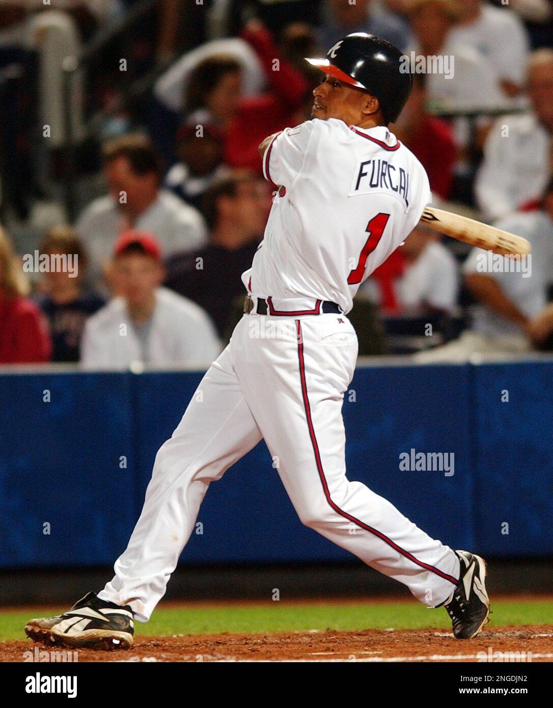 Atlanta Braves' Rafael Furcal hits a home run in the fifth inning against the Houston Astros in Game 5 of the National League Division Series at Turner Field in Atlanta, Monday Oct. 11, 2004. (AP Photo/Chris O'Meara) Banque D'Images
