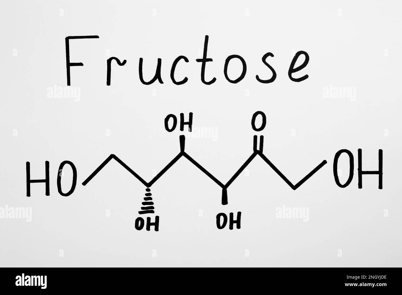 Mot fructose avec dessin sur papier, vue de dessus Banque D'Images