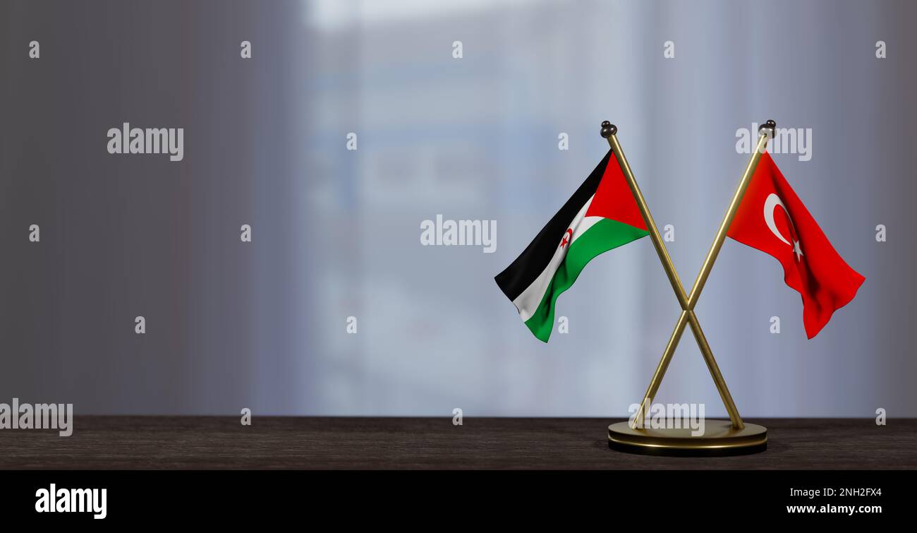 La République démocratique arabe sahraouie et la turquie sont des drapeaux sur la table. Négociation entre la République démocratique arabe sahraouie et le turkiye. sur peu flou backgroun Banque D'Images
