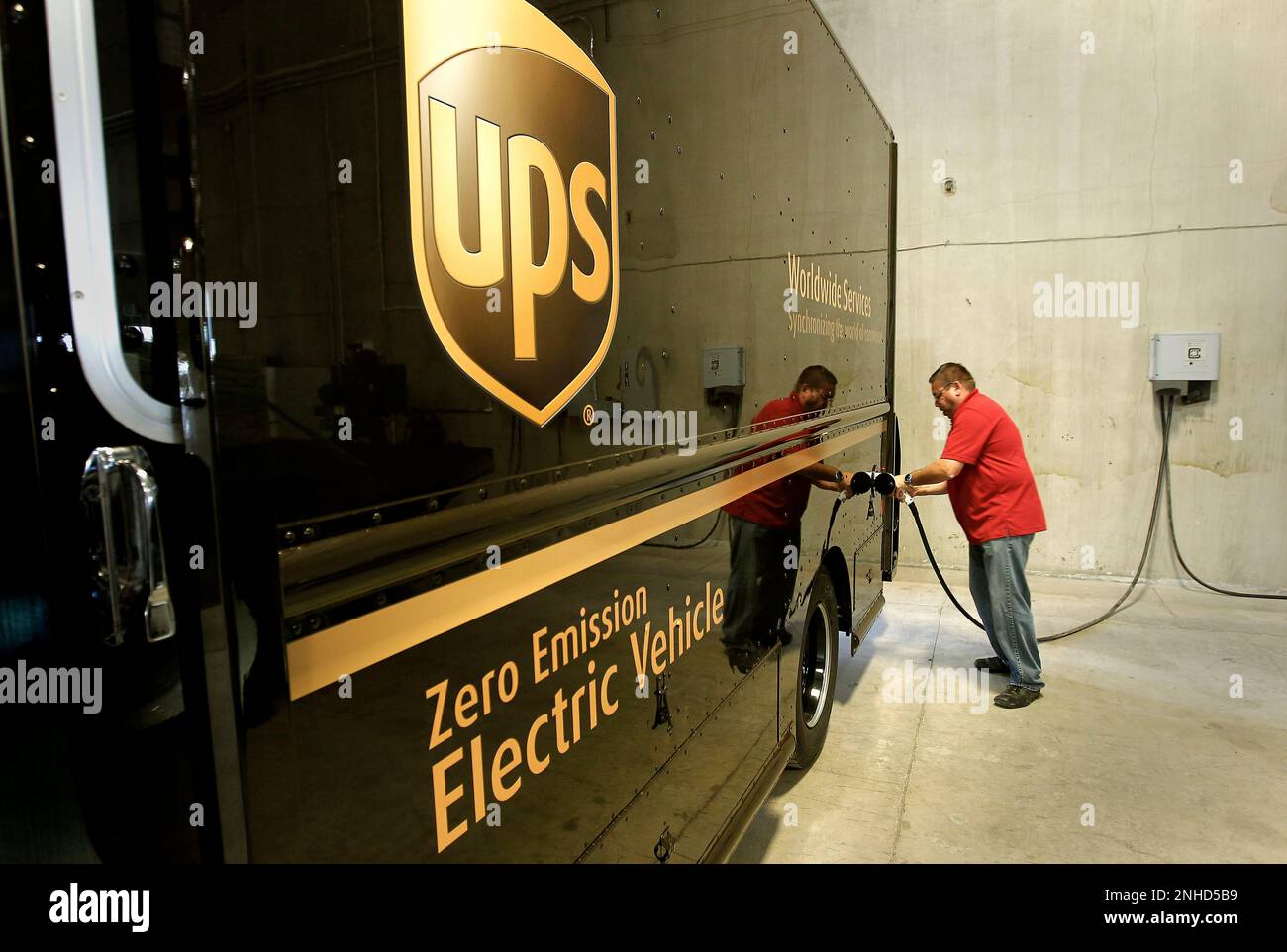 General manager, Robert Falcon at the charging station with the very