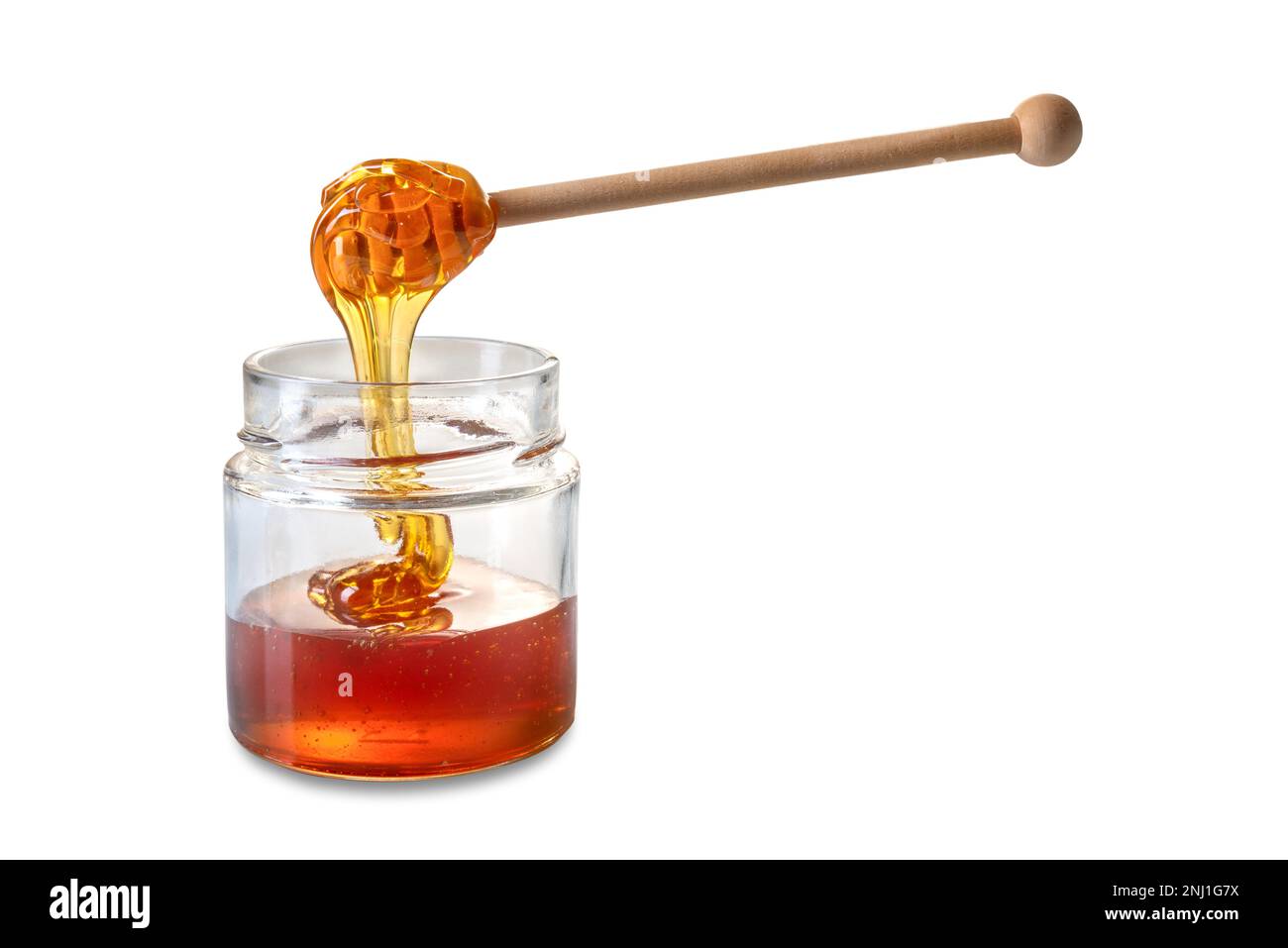 Miel goutte de miel en bois de la louche de miel dans un pot en verre, miel  de châtaignier de couleur ambre, isolé sur blanc avec un chemin de coupure  Photo Stock -