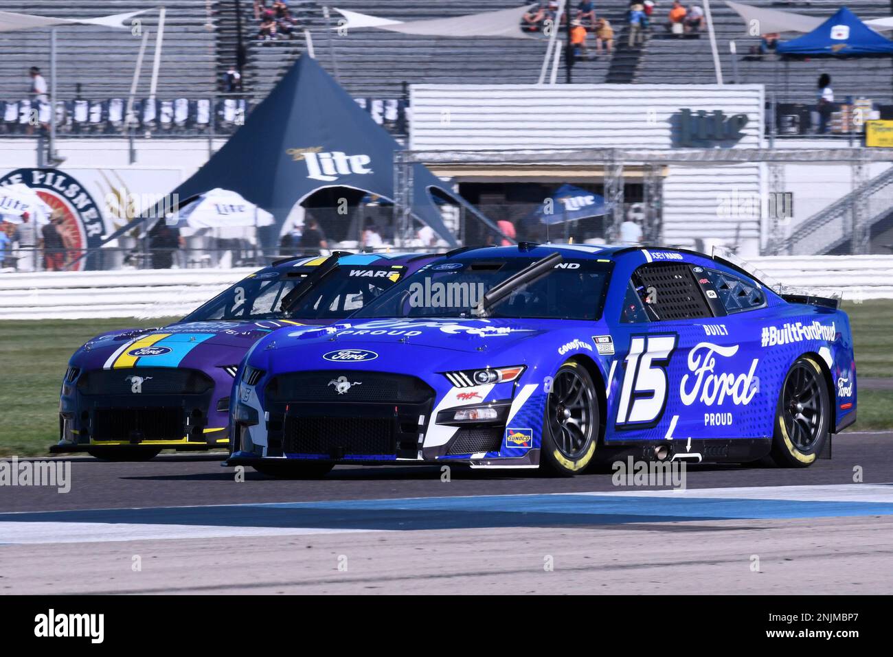 INDIANAPOLIS, IN - JULY 30: Joey Hand (#15 Rick Ware Racing Built Ford Proud Ford) races Cody Ware (#51 Rick Ware Racing Nurtec ODT Ford) along Hulman Boulevard during practice for the NASCAR Cup Series Verizon 200 at the Brickyard on Indianapolis Motor Speedway Road Course in Speedway, Indiana. (Photo by David Allio/Icon Sportswire) (Icon Sportswire via AP Images) Banque D'Images