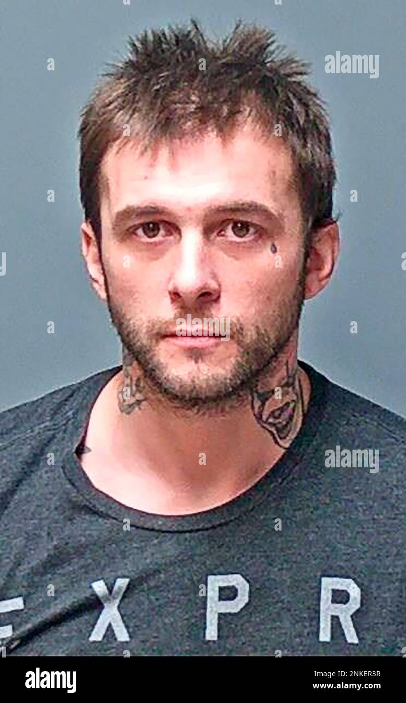 FILE — This undated booking photo provided by the Manchester Police Department shows Adam Montgomery, of Manchester, N.H. Montgomery, the father of a New Hampshire girl, Harmony Montgomery, who disappeared in 2019 at age five, has been arrested on eight firearms theft-related charges from that year that are unrelated to her case, the attorney general's office said Monday, April 4, 2022. (Manchester Police Department via AP, File) Banque D'Images