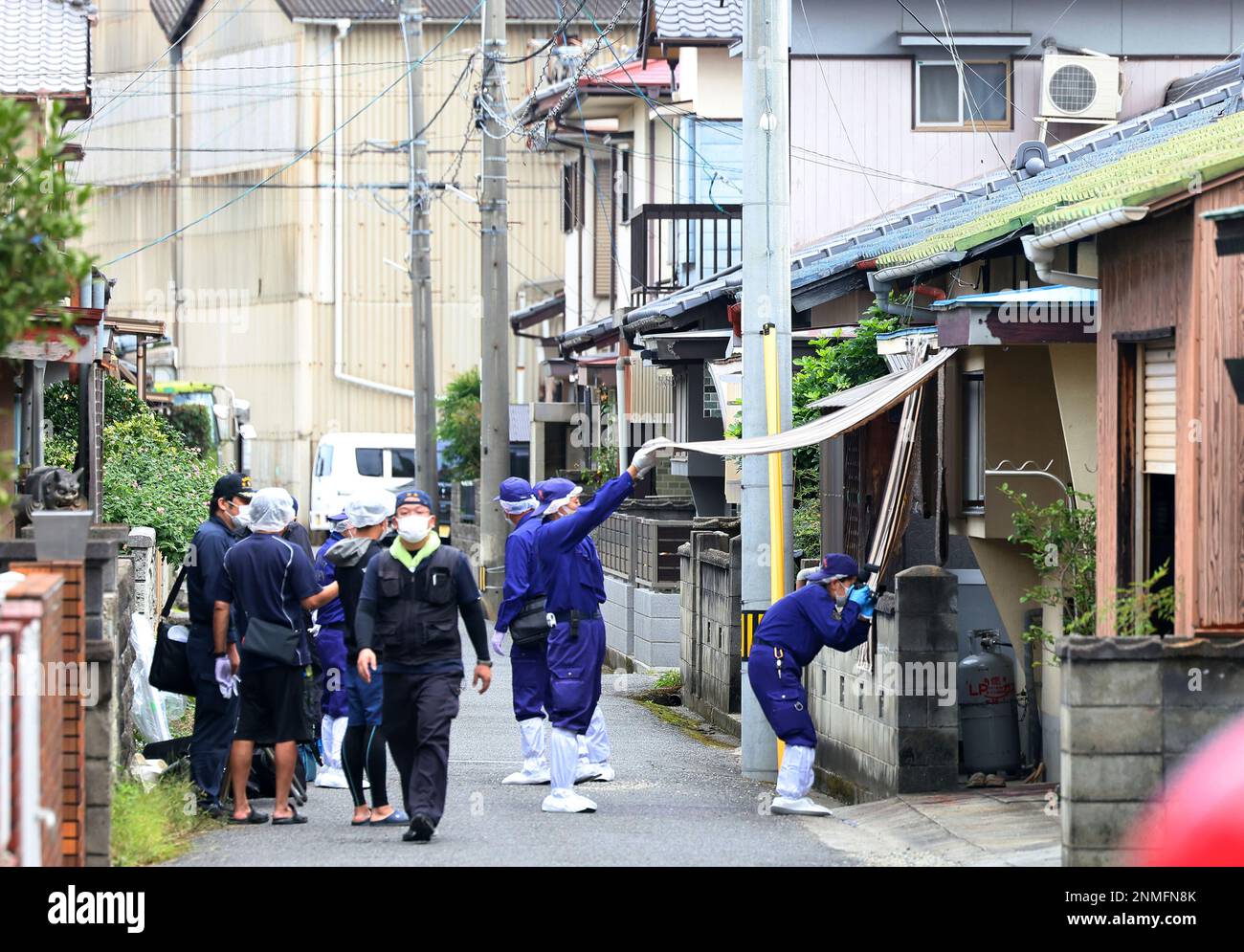 Ehime Prefectural Police Officers Investigate The Scene Of A 51 year ehime-prefectural-police-officers-investigate-the-scene-of-a-51-year
